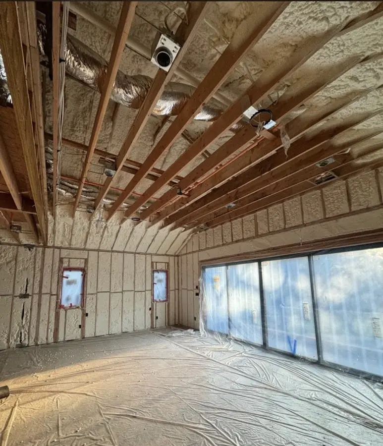 Interior walls and ceiling insulated with spray foam during new construction in West Seneca